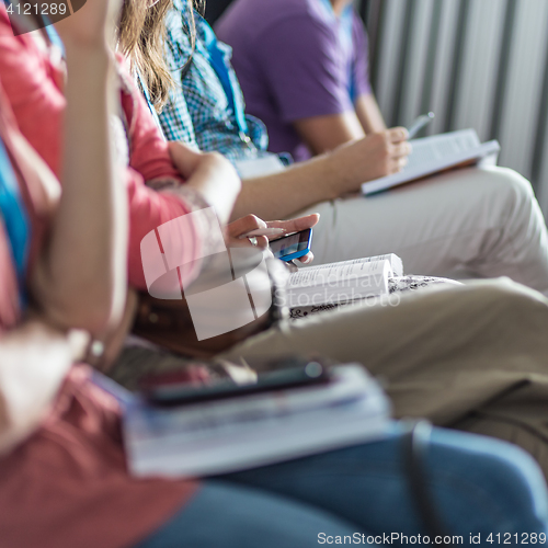 Image of Participants listening to lecture and making notes