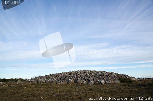 Image of An ancient burial place with a heap of stones