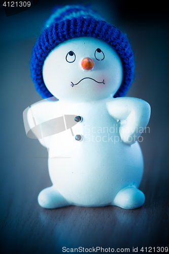 Image of Cute Snowman on Wooden Table