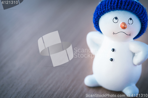 Image of Cute Snowman on Wooden Table