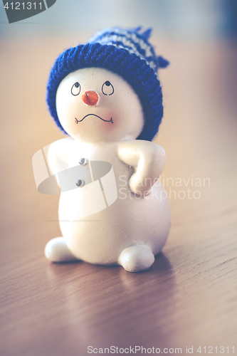 Image of Cute Snowman on Wooden Table