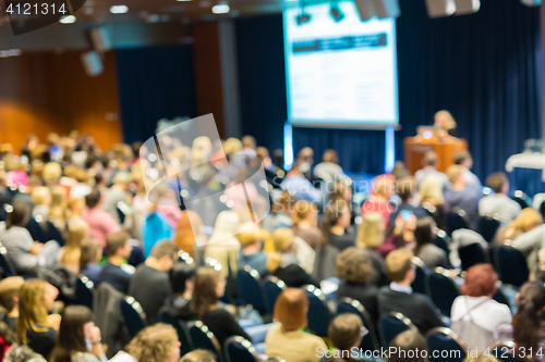 Image of Blured image of audience in conference hall attending business symposium.