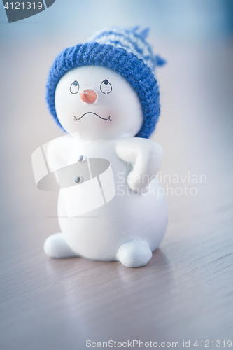 Image of Cute Snowman on Wooden Table