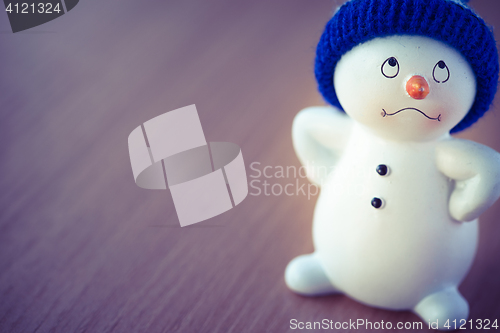 Image of Cute Snowman on Wooden Table