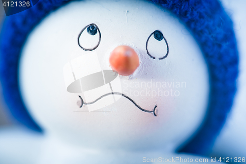 Image of Cute Snowman on Wooden Table