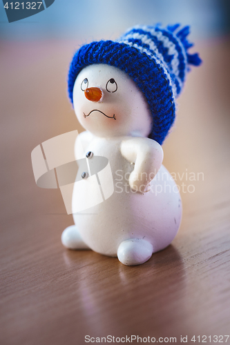 Image of Cute Snowman on Wooden Table