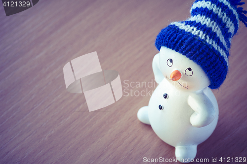 Image of Cute Snowman on Wooden Table