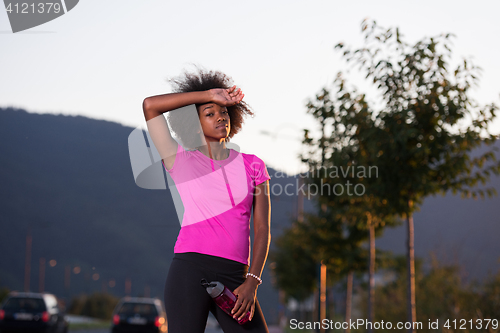 Image of Portrait of a young african american woman running outdoors