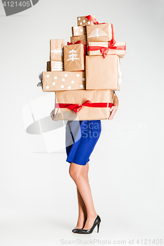 Image of Gift boxes in the hands of young woman