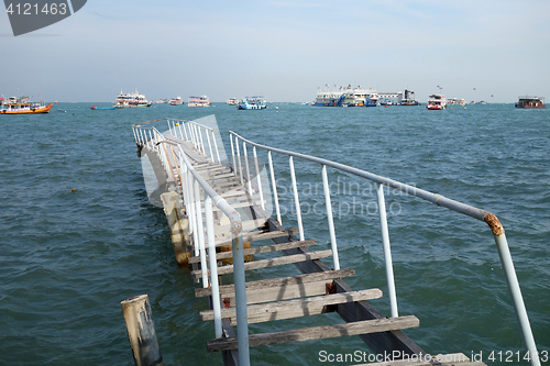 Image of The wooden bridge extending into the sea