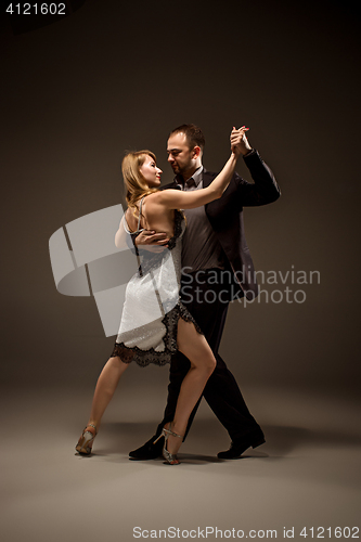 Image of The man and the woman dancing argentinian tango