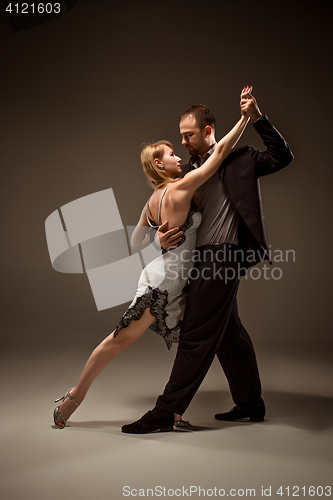 Image of The man and the woman dancing argentinian tango