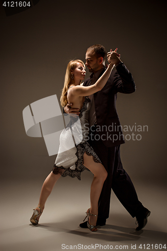 Image of The man and the woman dancing argentinian tango