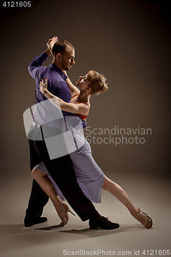 Image of The man and the woman dancing argentinian tango