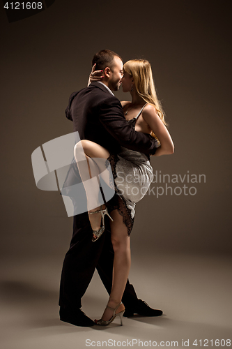 Image of The man and the woman dancing argentinian tango