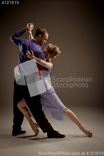 Image of The man and the woman dancing argentinian tango