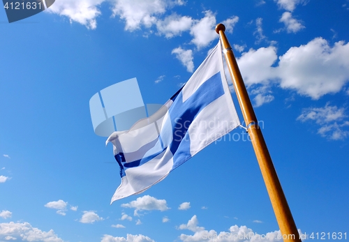 Image of Flag of Finland on a wooden flagpole
