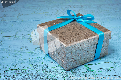 Image of Gift box with blue ribbon