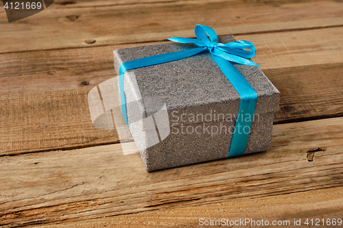 Image of Gift box with blue ribbon