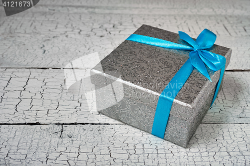 Image of Gift box with blue ribbon