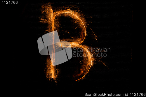 Image of Letter B made of sparklers on black