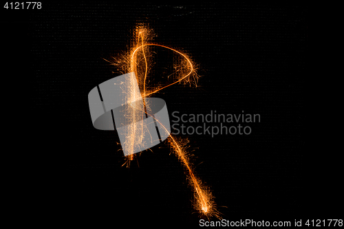 Image of Letter R made of sparklers on black