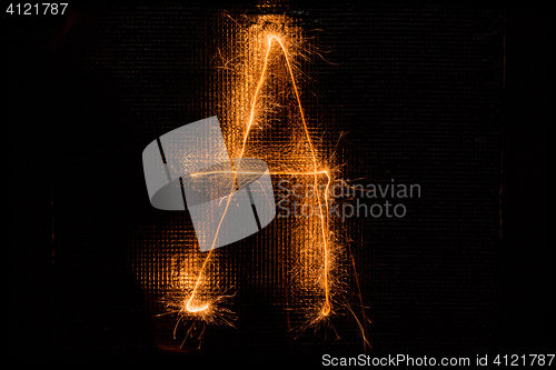Image of Letter A made of sparklers on black