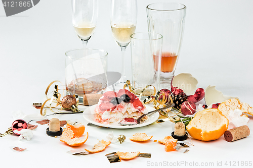 Image of The morning after christmas day, table with alcohol and leftovers