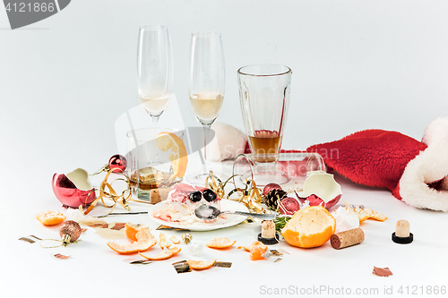 Image of The morning after christmas day, table with alcohol and leftovers