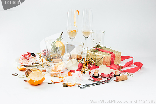 Image of The morning after christmas day, table with alcohol and leftovers