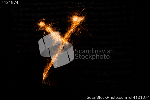 Image of Letter Y made of sparklers on black