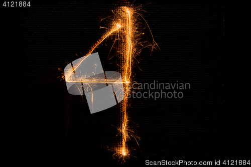 Image of Number 4 made of sparklers on black