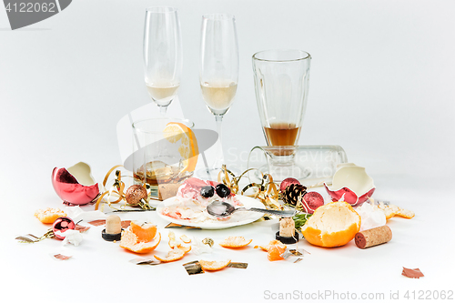 Image of The morning after christmas day, table with alcohol and leftovers