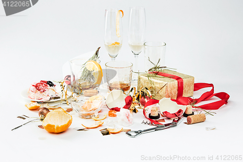 Image of The morning after christmas day, table with alcohol and leftovers