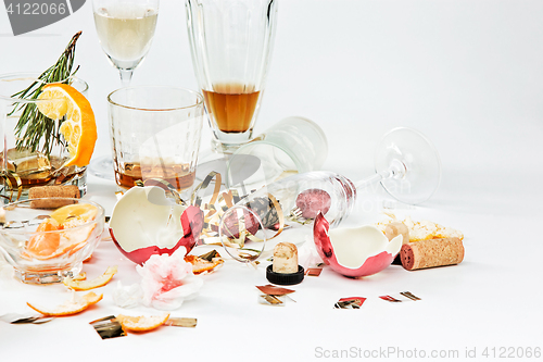 Image of The morning after christmas day, table with alcohol and leftovers