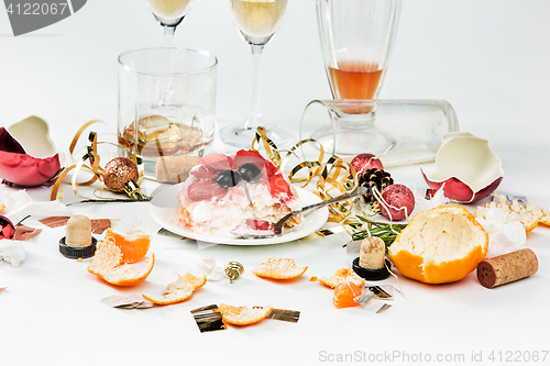 Image of The morning after christmas day, table with alcohol and leftovers