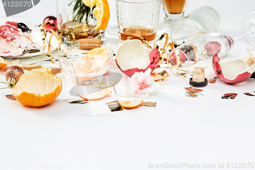 Image of The morning after christmas day, table with alcohol and leftovers