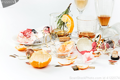 Image of The morning after christmas day, table with alcohol and leftovers