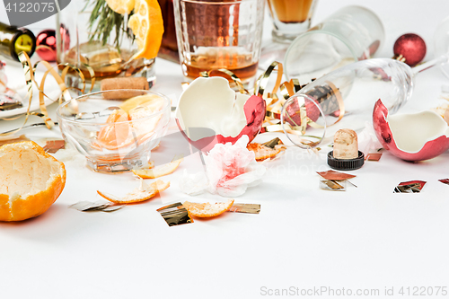 Image of The morning after christmas day, table with alcohol and leftovers