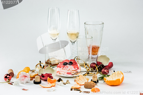 Image of The morning after christmas day, table with alcohol and leftovers