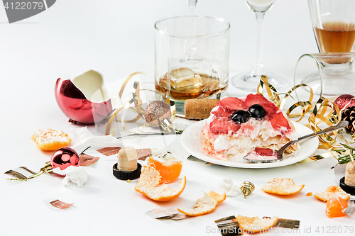 Image of The morning after christmas day, table with alcohol and leftovers