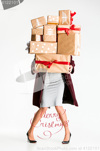 Image of Gift boxes in the hands of young woman