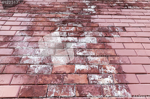 Image of painted with red paint bricks