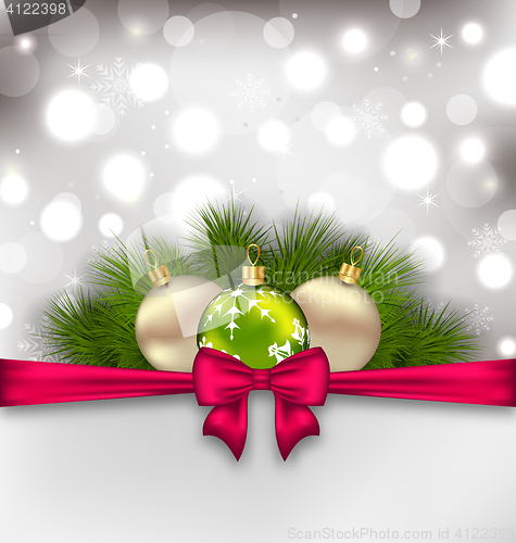 Image of Christmas glowing card with fir branches and glass balls