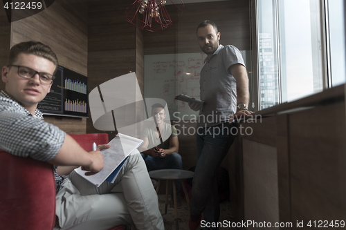 Image of team meeting and brainstorming in small private office