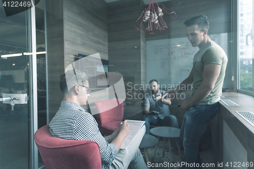 Image of team meeting and brainstorming in small private office