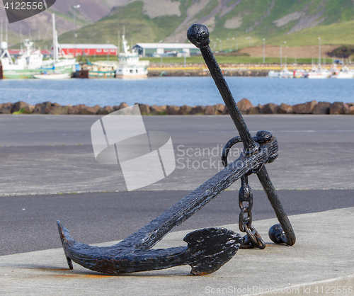 Image of Old anchor on the sea coast