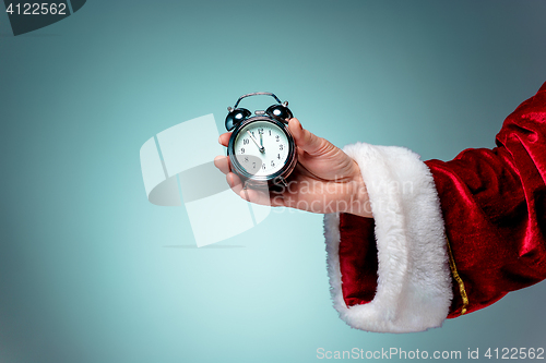 Image of Santa holding an old alarm clock