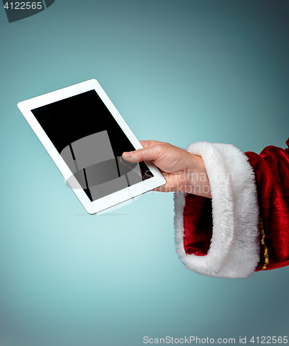Image of Santa Claus holding laptop