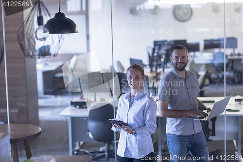 Image of business couple at office